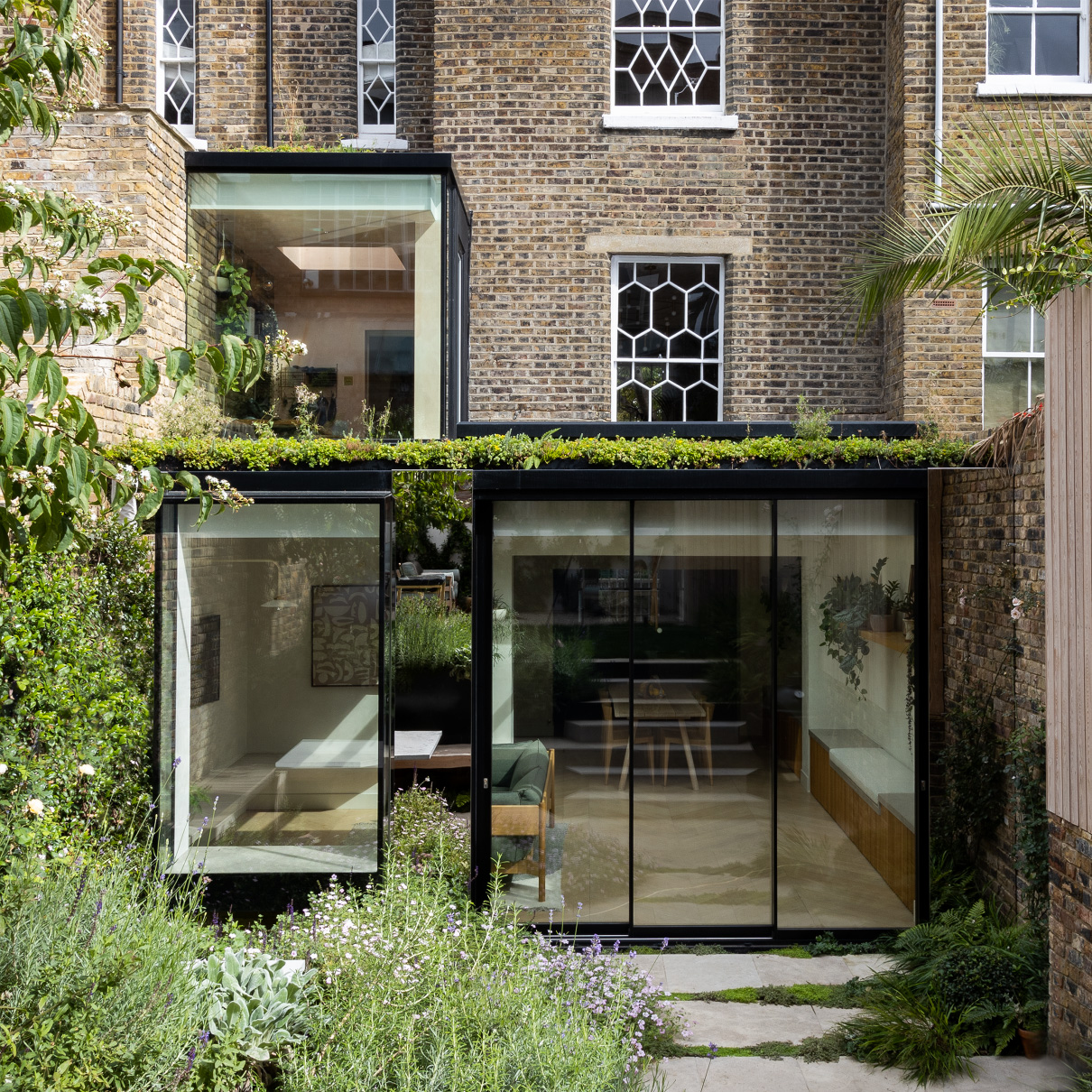 A mirrored facade extends the planting