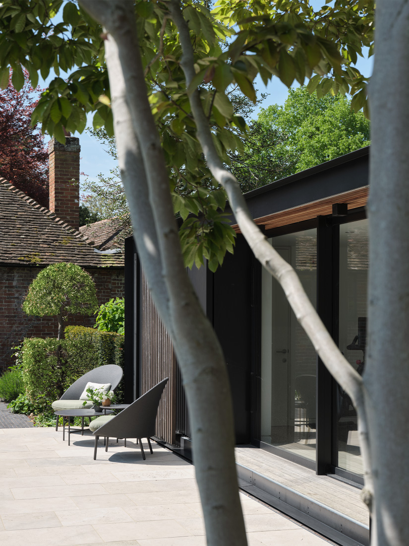 A contemporary pavilion overlooks the pool