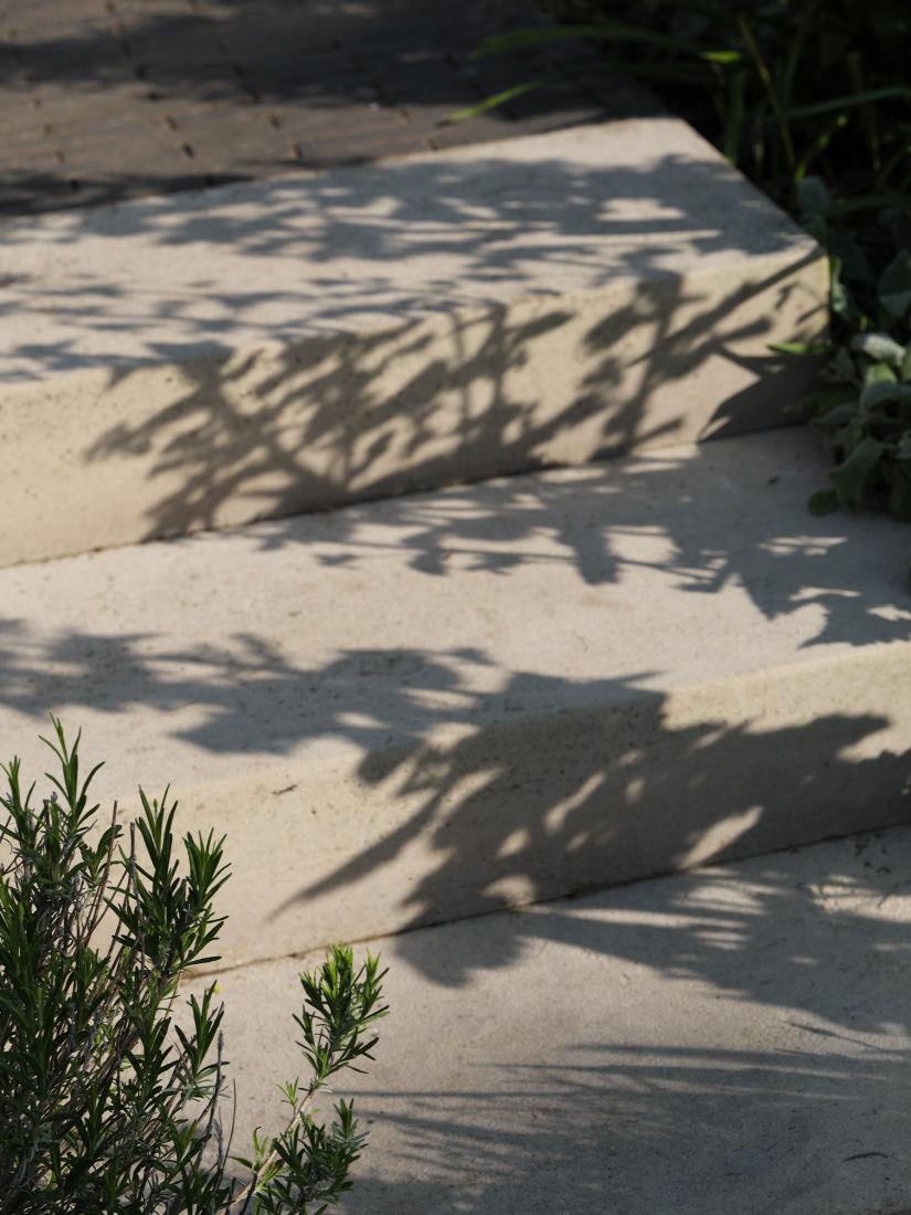 Generous steps in Purbeck stone define paths and gateways