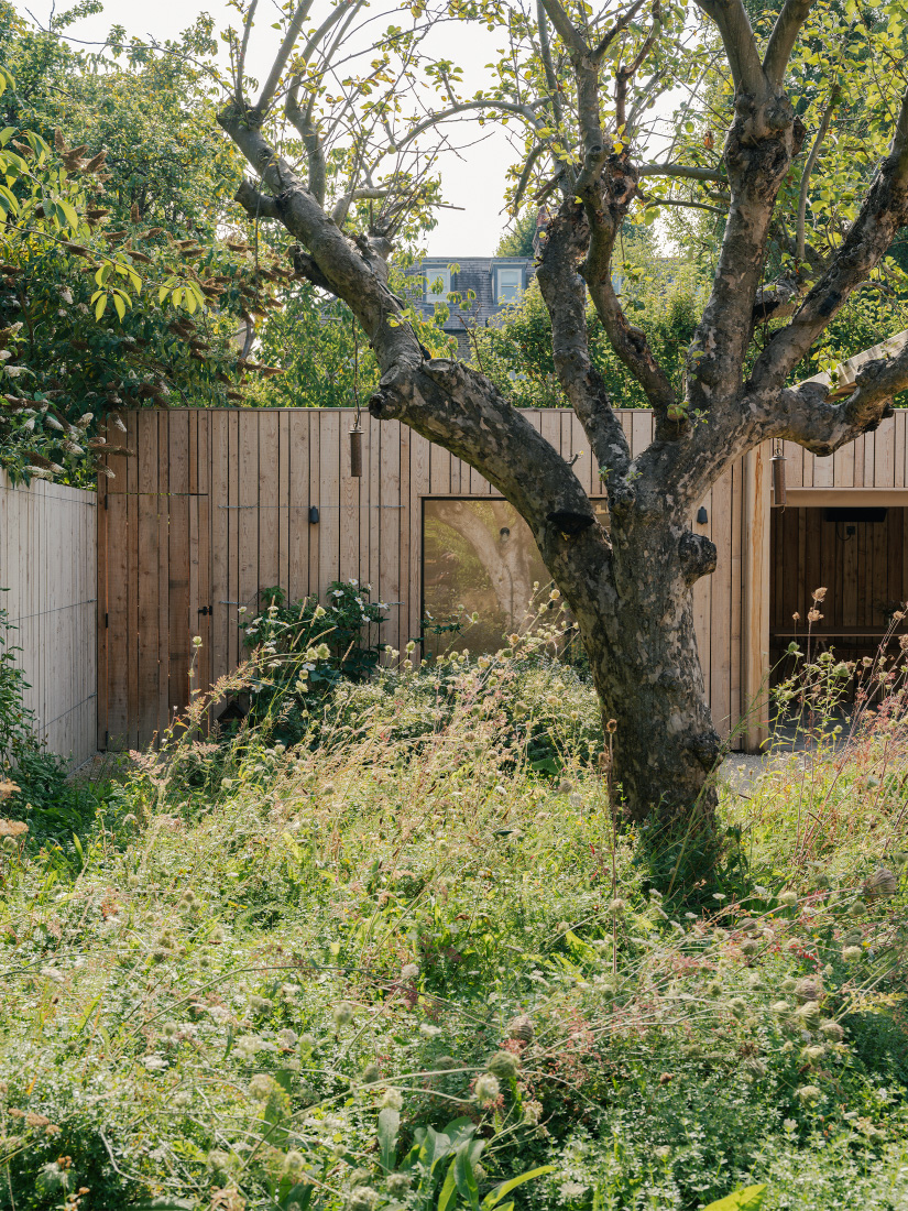 A meadow walk reveals a garden room