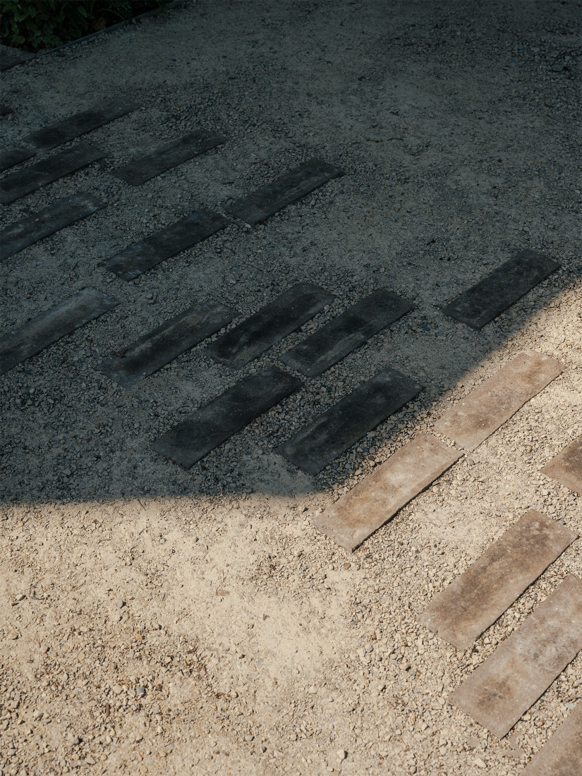 Brick paths lay like fallen leaves